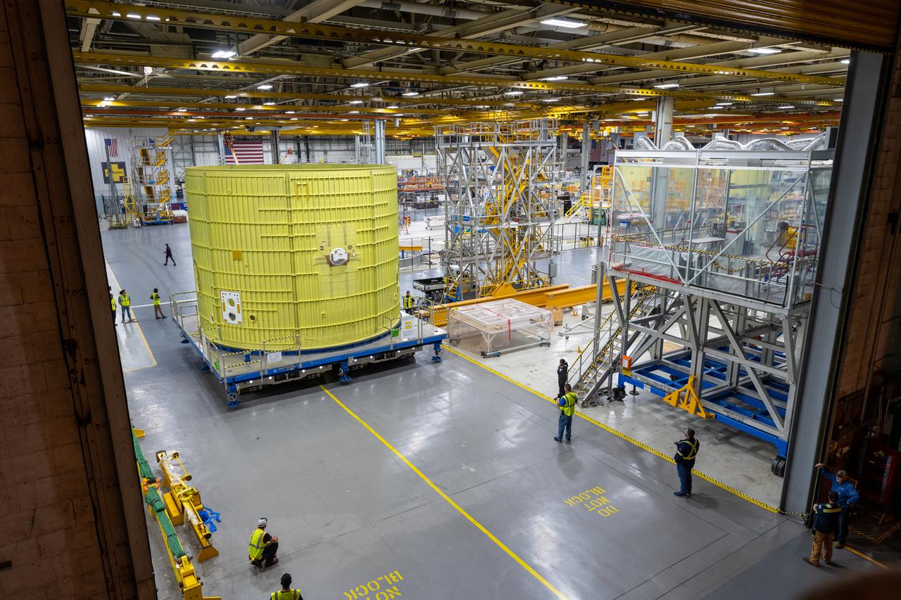 Technicians at NASA’s Michoud Assembly Facility move the intertank of NASA’s Space Launch System rocket for Artemis III to Cell G to await application of the thermal protection system. Thermal protection systems protect space vehicles from aerodynamic heating during entry to planet atmosphere and re-entry to earth atmosphere.  The intertank lays between the liquid hydrogen tank and liquid oxygen tank. Together with the engine section and the forward skirt, they comprise the SLS core stage. The liquid hydrogen tank and liquid oxygen tank hold 733,000 gallons of propellant to power the stage’s four RS-25 engines needed for liftoff and Artemis missions to the Moon and future missions to Mars.